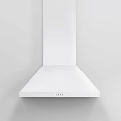 a white stove hood mounted on the wall