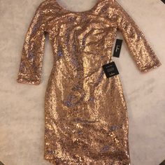 3/4 Sleeves. Stretchy Material With Sequins. Fitted Throughout Entire Dress. Pulls Down To Right Above Knee On 5’2 Person. Never Worn, Tags Still On. Lulus Dress, Silver Sequin Dress, Long Sleeve Skater Dress, Bodycon Sweater Dress, Lulus Dresses, Rose Gold Sequin, Ribbed Sweater Dress, Long Sleeve Wrap Dress, Grey Sweater Dress