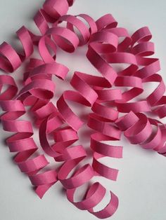 pink ribbon on white background with no image to describe, it is very easy to make