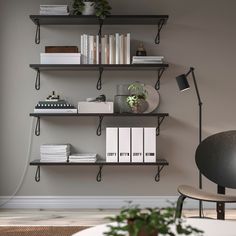 a living room with some books on the shelves