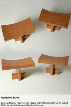 three wooden benches sitting on top of each other