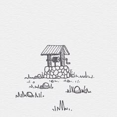 a drawing of a birdhouse in the middle of some grass with rocks around it