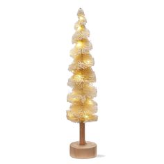 a lighted christmas tree on a wooden stand