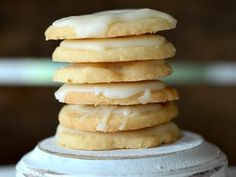 a stack of donuts sitting on top of a white plate