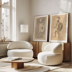 a living room filled with furniture and paintings on the wall next to a fire place