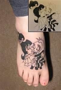 a person with a mickey mouse tattoo on their foot and an image of the same cartoon character