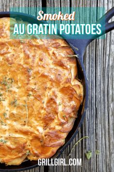 a skillet with some food in it on top of a wooden table and text overlay reads smoked au gratin potatoes