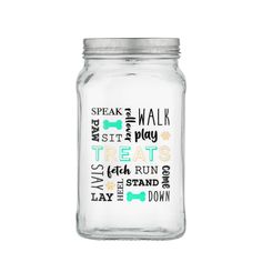 a glass jar with words on it and a dog's name in the bottom