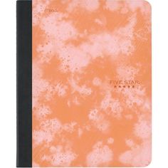 an orange and black notebook with five star writing on the front, which is covered in white speckles