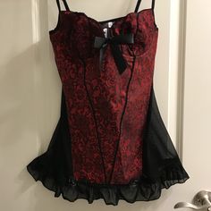 Sexy Red Brocade Bustier With Bows And Ruffles. Size L. Never Worn. Made In China From Polyester Material. Elastic Mesh Back. Pit To Pit 14.5 Unstretched Waist 13.5 Unstretched Hip 17 Unstretched Length Underarm To Hem Ruffle 19 Red Party Corset With Built-in Bra, Red Sleeveless Corset With Boning, Red Corset With Built-in Bra For Night Out, Red Underwire Party Corset, Red Underwire Corset For Party, Red Corset With Built-in Bra, Party Corset With Built-in Bra In Red, Red Sleeveless Corset With Built-in Bra, Red Fitted Corset With Built-in Bra