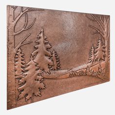 a brown leather wall hanging with trees on it