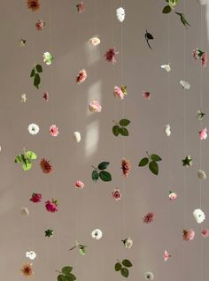 flowers are hanging from the ceiling in a room