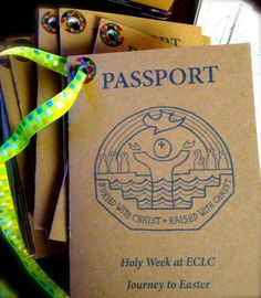 a passport sitting on top of a pile of books next to a neon green lanyard