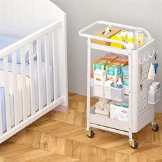 a white baby changing table next to a crib