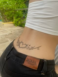 a woman with a tattoo on her stomach