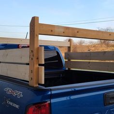 a truck with a wooden bed rack in the back