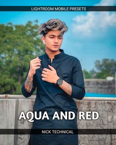 a man standing next to a wall with his hands on his chest and the words aqua and red above him