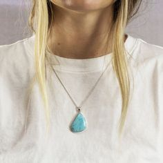 This Organic shaped Larimar necklace displays a vibrant blue. Larimar is a stone for Earth Healing. Known to represent peace and love this necklace can help bring a serene environment to its wearer. Stone Origin: Dominican Republic Measures Approximately: 24 x 28 mm Materials: Hand Crafted 925 Polished Sterling Silver and Italian adjustable belcher chain. Please Note: If you would like to purchase a different chain please purchase pendant only and click here. All pieces shipped within 48 hours f Blue Larimar Teardrop Jewelry, Blue Teardrop Larimar Jewelry, Larimar Gemstone Pendant Necklaces, Larimar Gemstone Pendant Necklace, Spiritual Larimar Pendant Jewelry, Spiritual Larimar Gemstone Necklace, Blue Teardrop Necklace With Large Stone, Blue Amazonite Necklaces For Gift, Blue Amazonite Necklace For Gift