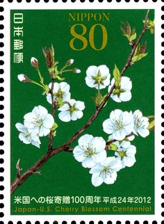 a stamp with white flowers on it and the words nippon 80 written in chinese characters