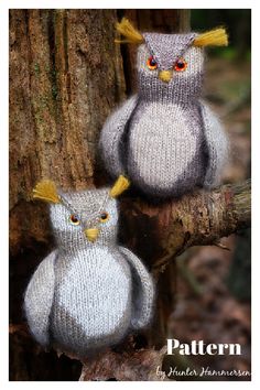 two knitted owls sitting next to each other on a tree branch