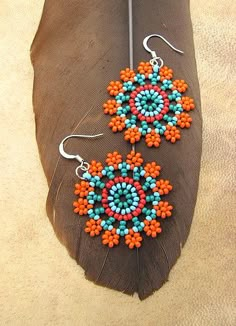 the earrings are made with beads and feathers