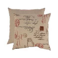 a pillow that has stamps on it and is made out of fabric with red ink