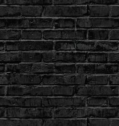 an old black brick wall with no mortars or mortars on the bottom half