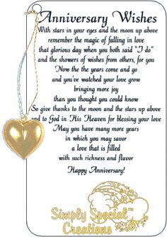 an anniversary card with a gold heart hanging from it's front and back side