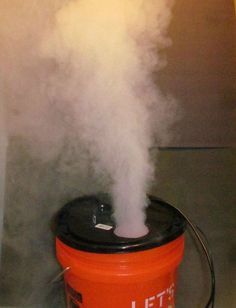 an orange bucket with steam coming out of it