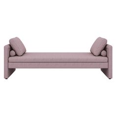 a pink couch with two pillows on it's back and the seat upholstered