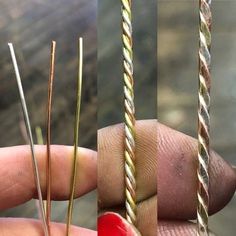 three different types of needles being held in one hand and two fingers holding the other