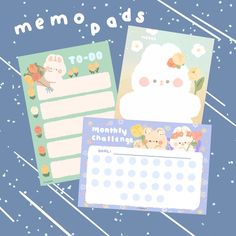 two memo pads with animals and flowers on them