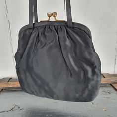 Vintage 1960s Black satin purse, small bag, French 60s with kiss clasp. Dimensions: 19cm high (33cm high incl. handle) x 21cm wide Vintage Black Shoulder Bag With Hasp Closure, Vintage Clutch Shoulder Bag For Party, Vintage Pouch Bag For Party, Victorian Style Black Bag For Vintage Events, Black Victorian Bag For Vintage Events, Vintage Black Pouch Shoulder Bag, Black Vintage Bags For Vintage Events, Vintage Black Bag For Vintage Events, Vintage Black Pouch Evening Bag