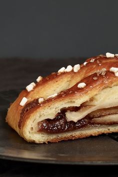 a close up of a pastry with toppings on it