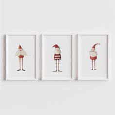 three framed art prints with santa clauss in red and white outfits, one holding a bag