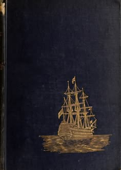 an old book with a golden ship on it