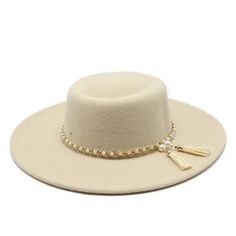 Style: Wide Brim Fedora Hats for Women Item Types: Hats for women, wool fedora hat women's, womens fedora summer hats, womens fedora hat wide brim Gender: Unisex Detail: Imitation pearl tassel band Feature: Fashion accessory, sun protection Material: Cotton Material: Polyester Material: Wool Elegant Felt Bucket Hat, Elegant Brimmed Panama Hat For Winter, Elegant Beige Winter Fedora, Elegant Felt Hat For Beach In Fall, Beige Fedora Hat For Party, Elegant Solid Color Sun Hat With Flat Brim, Elegant Fall Beach Felt Hat, Elegant Solid Color Felt Hat For Spring, Elegant Solid Felt Hat For Spring