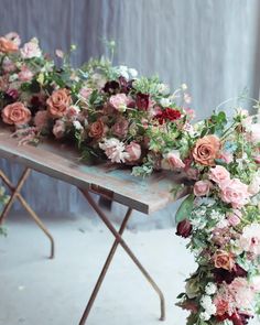 an arrangement of flowers arranged on a table