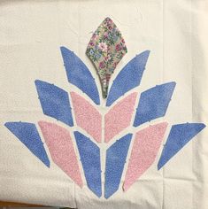 a piece of paper with blue and pink flowers on it