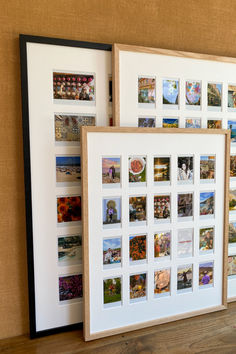 two framed pictures are sitting next to each other on a shelf in front of a wall