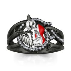 Have you heard the love story between scarecrow-like creation and skeleton? This ring is the classic scene that they share a passionate kiss on top of Spiral Hill. Crafted in black-tone sterling silver and exquisitely designed, it holds an iconic figure of skull couple atop Spiral Hill. As a great Halloween and Christmas gift, the meaningful ring celebrates your everlasting love.Carat Weight: 0.226 ctStone Size: 0.8,1 mmStone Type: Jeulia® StoneNumber of Stones: 37 Stone Shape: RoundStone Color: Diamond WhiteWeight: 5.81 gWidth: 2.6 mmThickness: 1.3 mmMaterial: 925 SilverPlating Color: Silver, Black Skull Couple, Delicate Wedding Ring, Meaningful Rings, Skeleton Ring, Artistic Earrings, Jack Skeleton, Silver Skull Ring, Couples Ring Set, Mens Rings Fashion