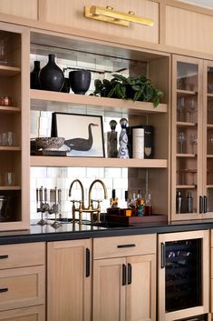 a kitchen filled with lots of wooden cabinets and counter top space next to an oven