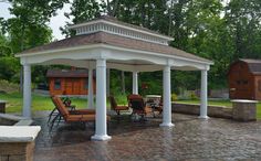 a gazebo sitting on top of a brick patio