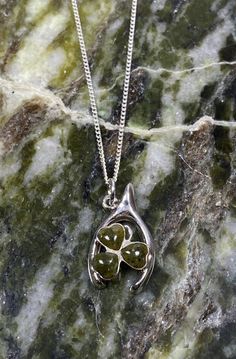 "This Sterling Silver HorseShoe Design Pendant is 925 Hallmarked and is designed in Ireland. It is set with Three Heart Shaped pieces of Connemara marble which have been mined from deep under the Twelve Bens Mountains in the West of Ireland and has been created into a  Shamrock Design. The Pendant is  19.88 mm Long and 11.82 mm wide with Three Heart Shaped 4.75 mm Connemara marble Stones set in the Pendant. A very Unique design with the Shamrock Fixed sideways into the Horseshoe. This Pendant Co Shamrock Jewelry, Horseshoe Design, Shamrock Design, Irish Symbols, Silver Shamrock, Connemara Marble, Ancient Celts, Irish Jewelry, Irish Traditions