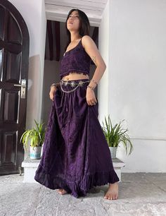 Introducing our Pari Vintage Vibe Purple Top & Maxi Skirt, perfect for embracing boho hippie vibes! This stunning set includes a maxi skirt with a pleated border that adds a touch of elegance and offers a chic, comfortable fit. Crafted with comfort yet elegant fashion in mind, this ensemble is ideal for creating enchanting looks. Choose between two top variations: a halter top or a smocked top, both designed to complement the flowing silhouette of the skirt. Available in various sizes, this set Bohemian Summer Festival Maxi Skirt, Bohemian Long Skirt For Festival, Bohemian Long Pleated Skirt, Summer Bohemian Flared Maxi Skirt, Bohemian Purple Maxi Skirt For The Beach, Bohemian Flared Maxi Skirt For Summer, Flowy Bohemian Maxi Skirt, Purple Bohemian Maxi Skirt For Vacation, Bohemian Purple Maxi Skirt For Vacation