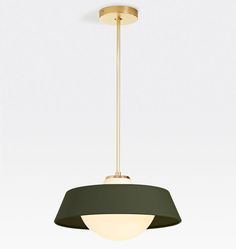 a green and gold pendant light hanging from a ceiling