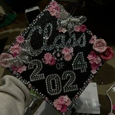 a decorated graduation cap sitting on top of a table