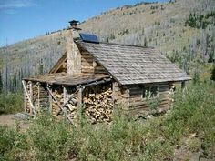 an old log cabin in the middle of nowhere