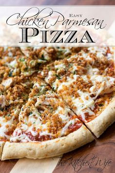 the chicken parmesan pizza is cut into slices and sits on a cutting board