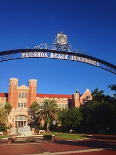 the entrance to florida state university under a blue sky